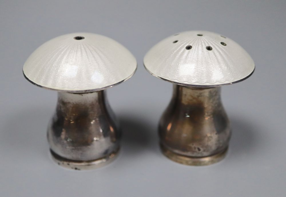 A pair of mid 20th century Danish sterling and enamel mushroom shaped condiments, by Egon Lauridsen, height 42mm.